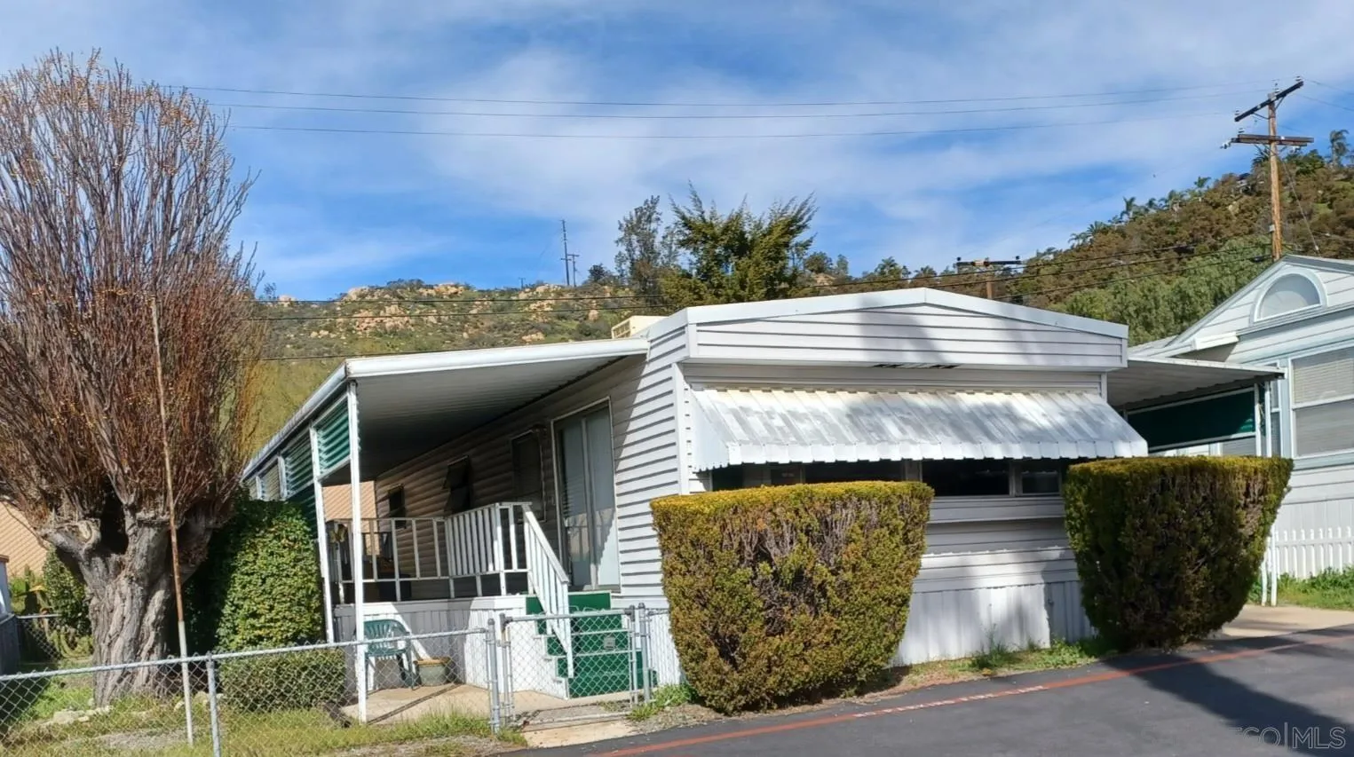 13644 Marigold Drive, Unit 176 Poway, CA 92064 - Photo 1 of 11 a front view of a house with a yard