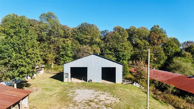 a backyard of a house with large trees