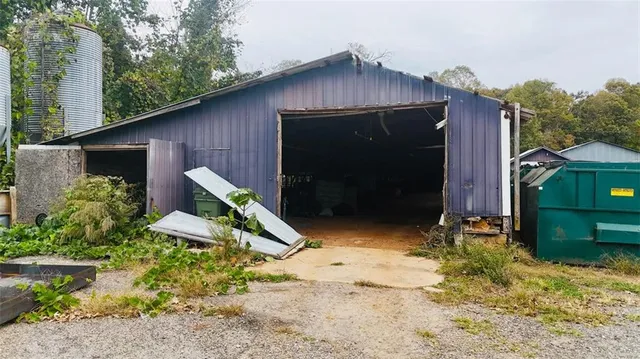 an aerial view of a house with yard swimming pool and outdoor seating