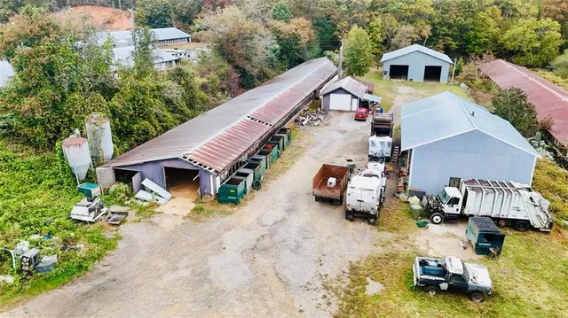 a view of a patio with table and chairs with wooden floor and fence