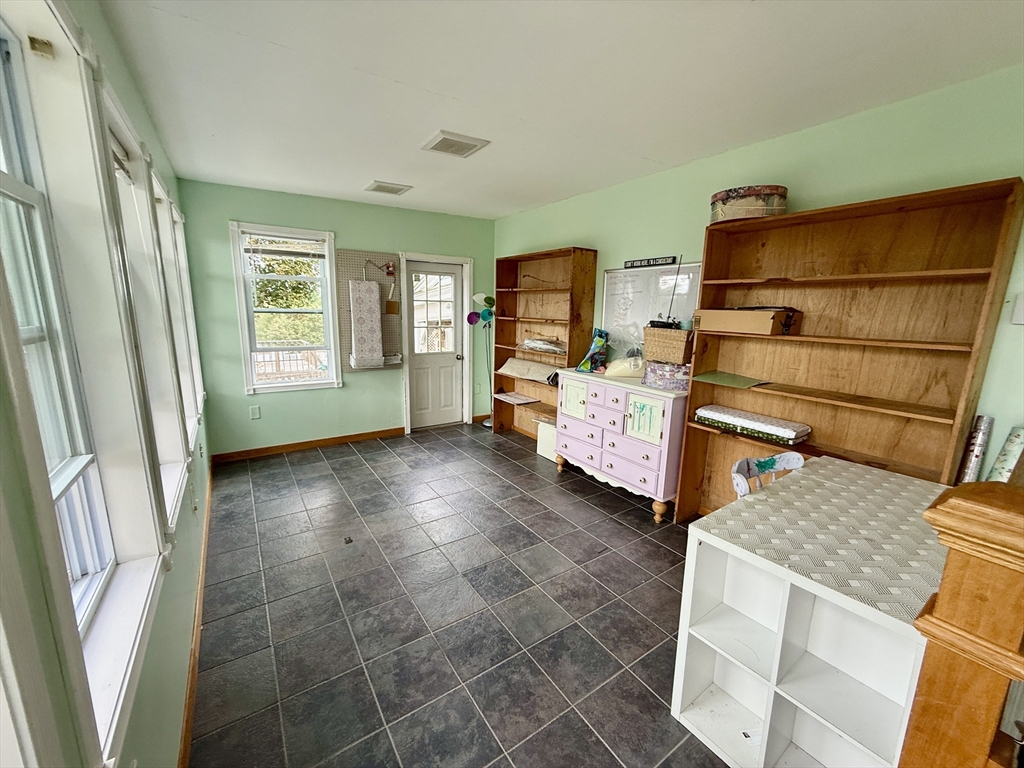 22 Baker Street Worcester, MA 01603 - Photo 13 of 35 a bed room with a bed and a window