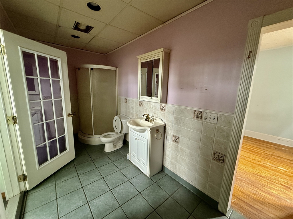 22 Baker Street Worcester, MA 01603 - Photo 17 of 35 a bathroom with a sink a toilet and shower