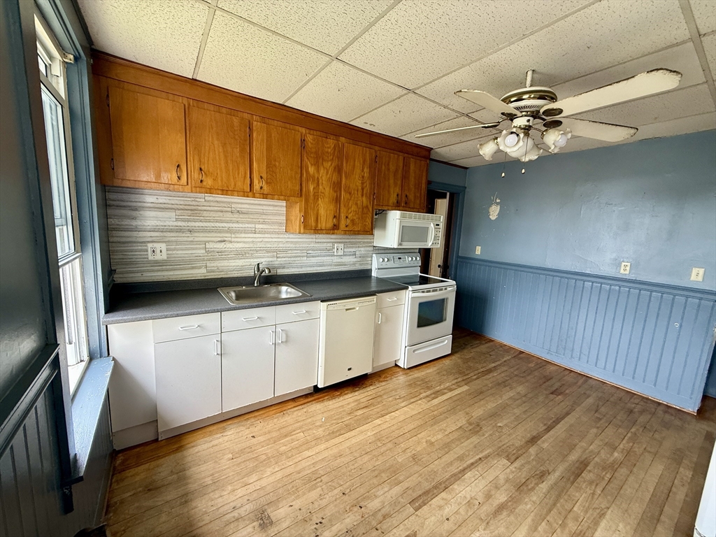 22 Baker Street Worcester, MA 01603 - Photo 25 of 35 a view of a kitchen with a sink and dishwasher