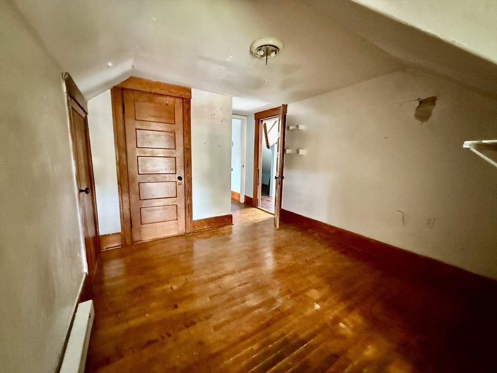 22 Baker Street Worcester, MA 01603 - Photo 27 of 35 an empty room with closet and a window