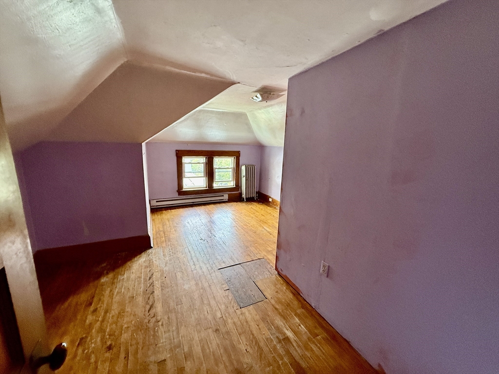 22 Baker Street Worcester, MA 01603 - Photo 29 of 35 a view of empty room with wooden floor and fan