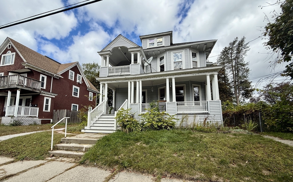 22 Baker Street Worcester, MA 01603 - Photo 3 of 35 a front view of a house with a yard