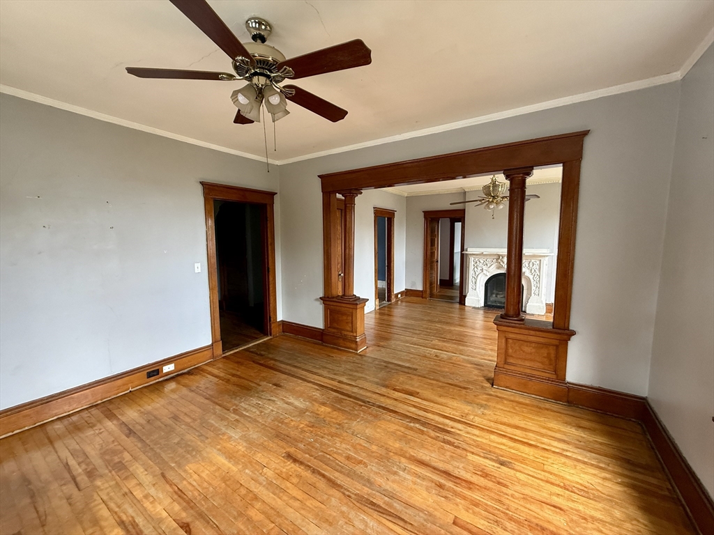 22 Baker Street Worcester, MA 01603 - Photo 5 of 35 a view of an empty room with window and wooden floor