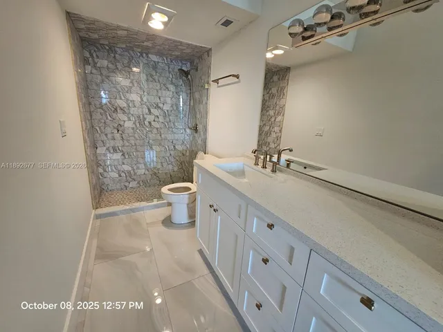 a view of a hallway with windows