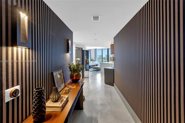 a large kitchen with a large window and stainless steel appliances