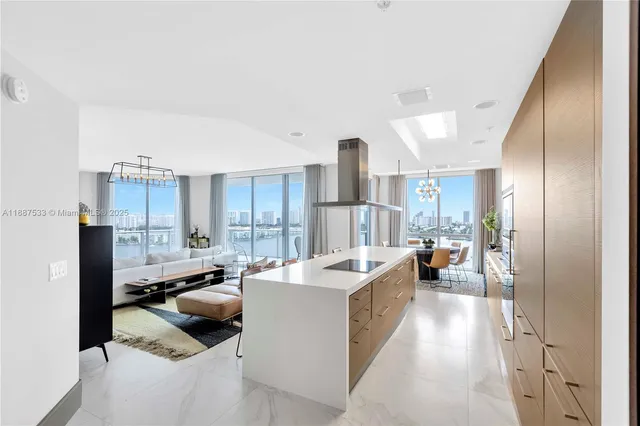 a kitchen with a counter space a sink and cabinets