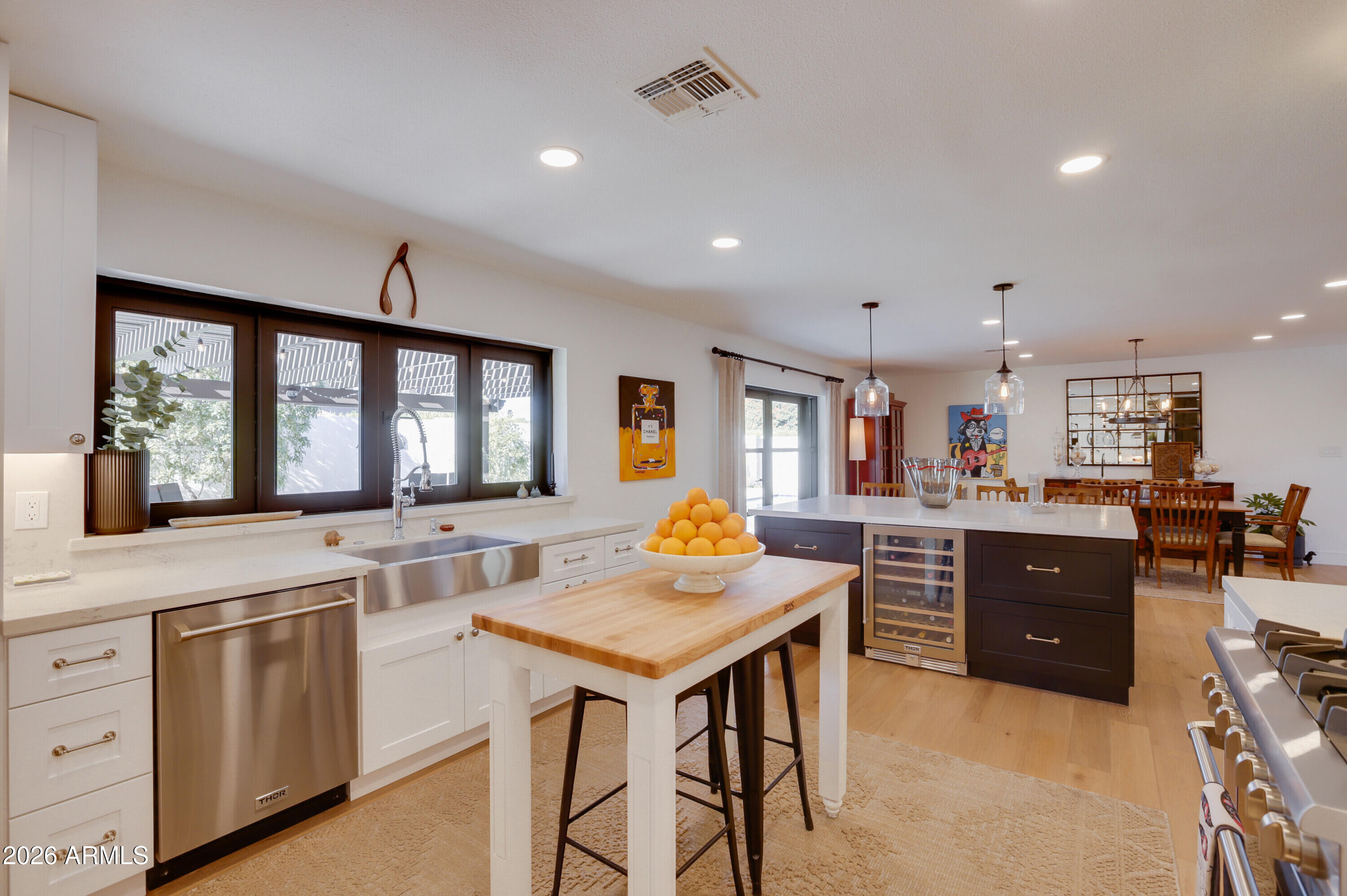 8220 North 1st Avenue Phoenix, AZ 85021 - Photo 21 of 53 a kitchen with stainless steel appliances granite countertop a stove a sink dishwasher and a refrigerator with wooden floor