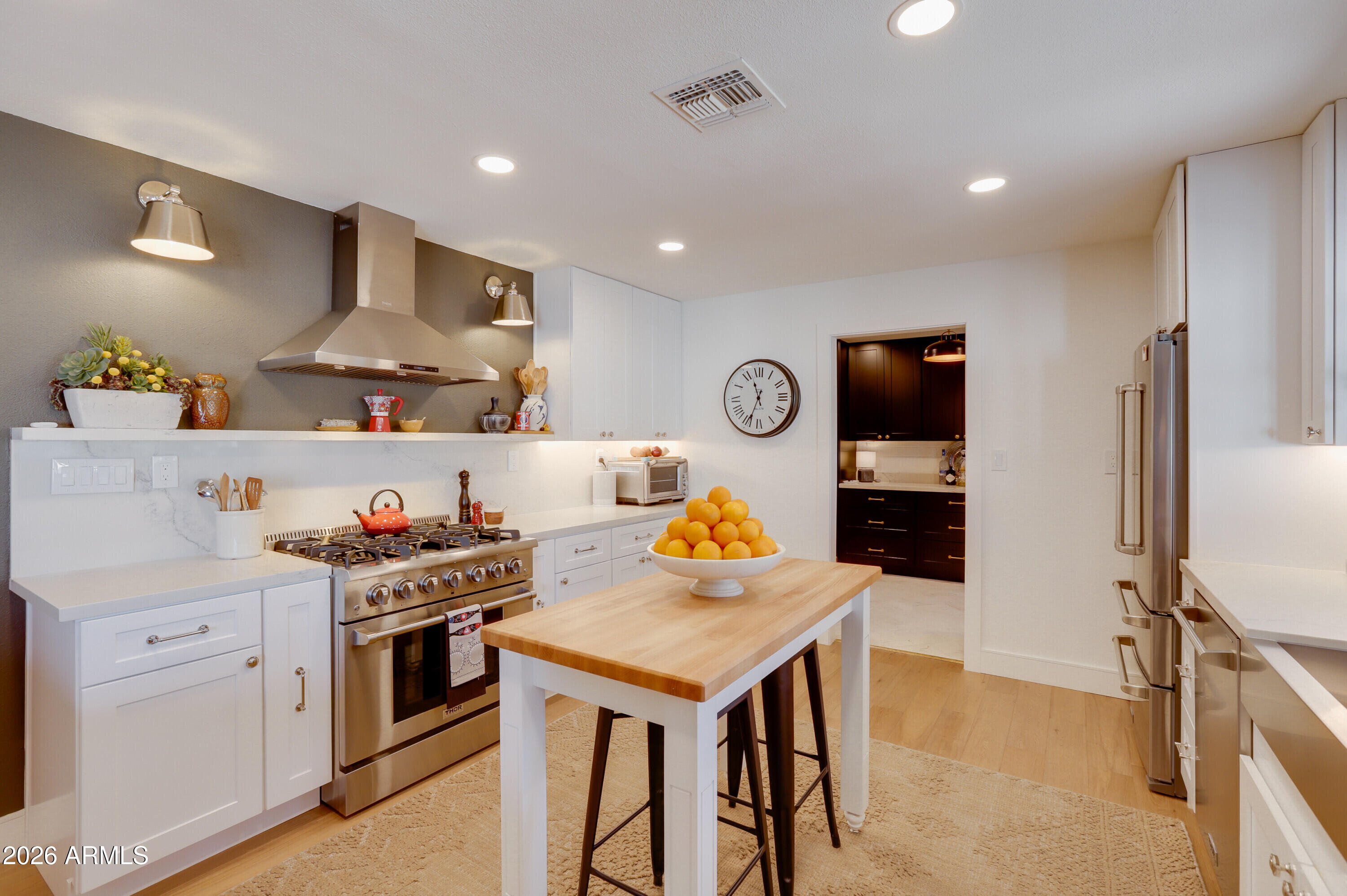 8220 North 1st Avenue Phoenix, AZ 85021 - Photo 23 of 53 a kitchen with stainless steel appliances granite countertop a stove and a refrigerator