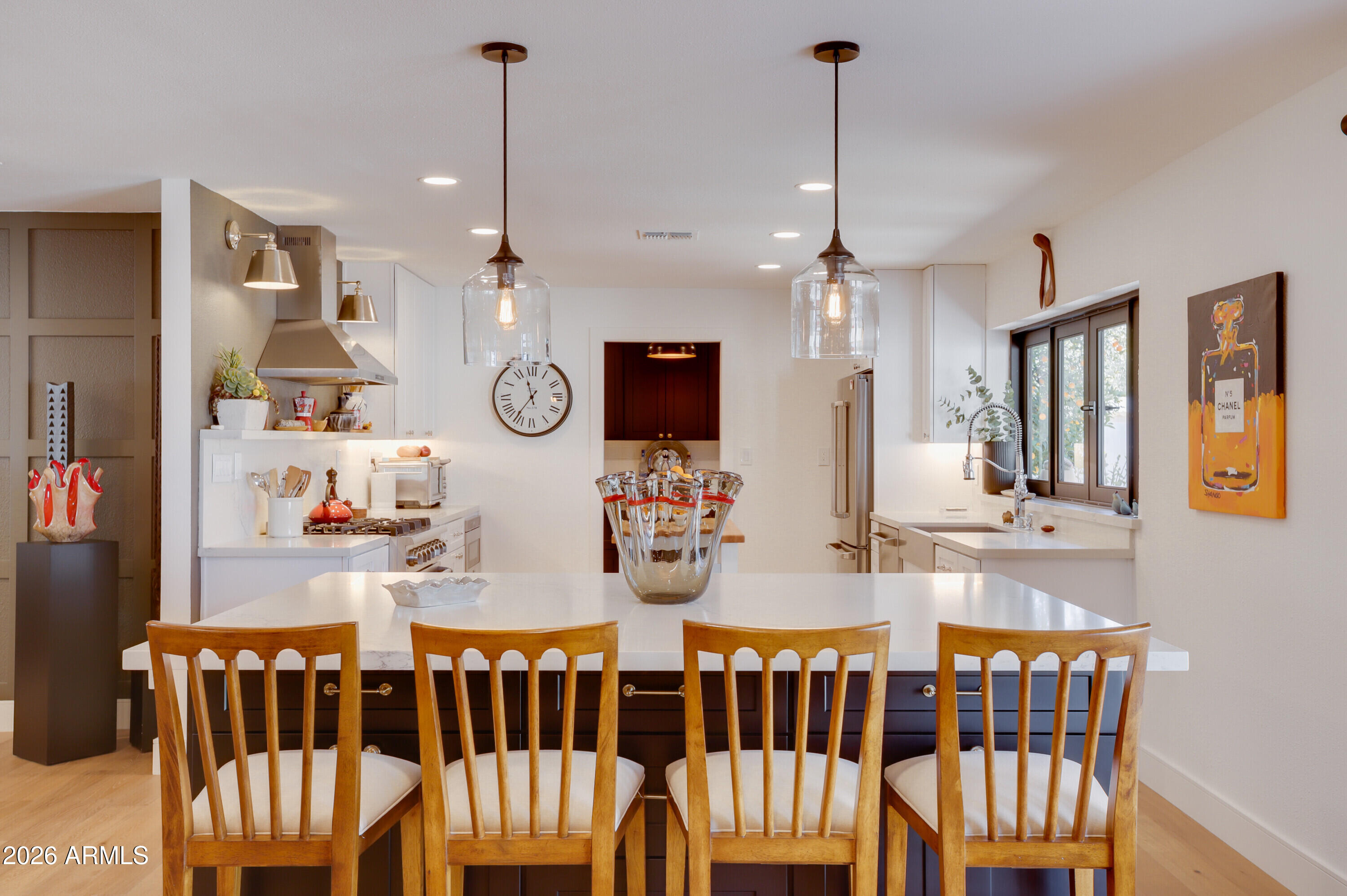8220 North 1st Avenue Phoenix, AZ 85021 - Photo 29 of 53 a view of dining room and kitchen with wooden floor
