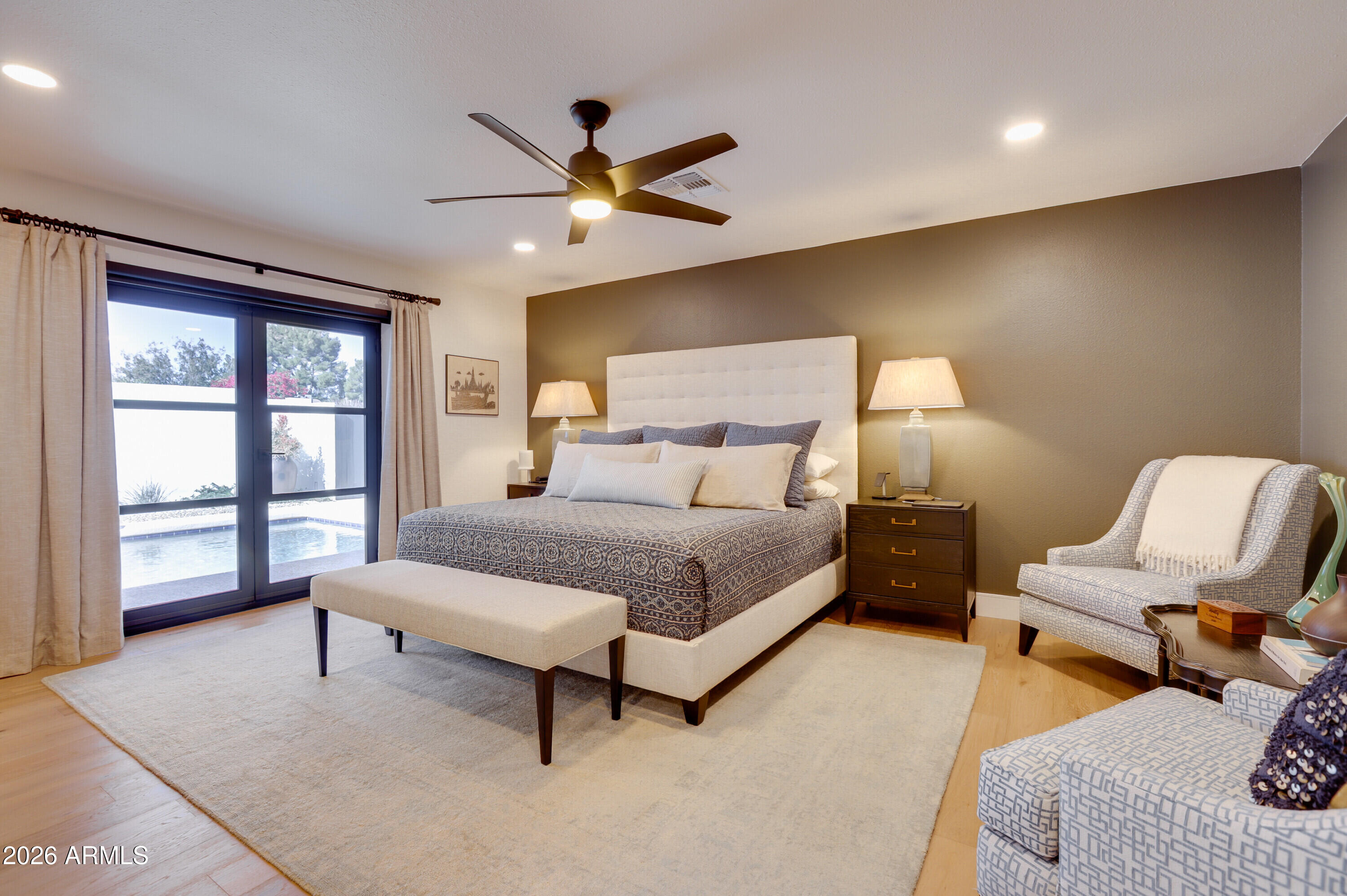 8220 North 1st Avenue Phoenix, AZ 85021 - Photo 32 of 53 a bedroom with a bed a couch and a window