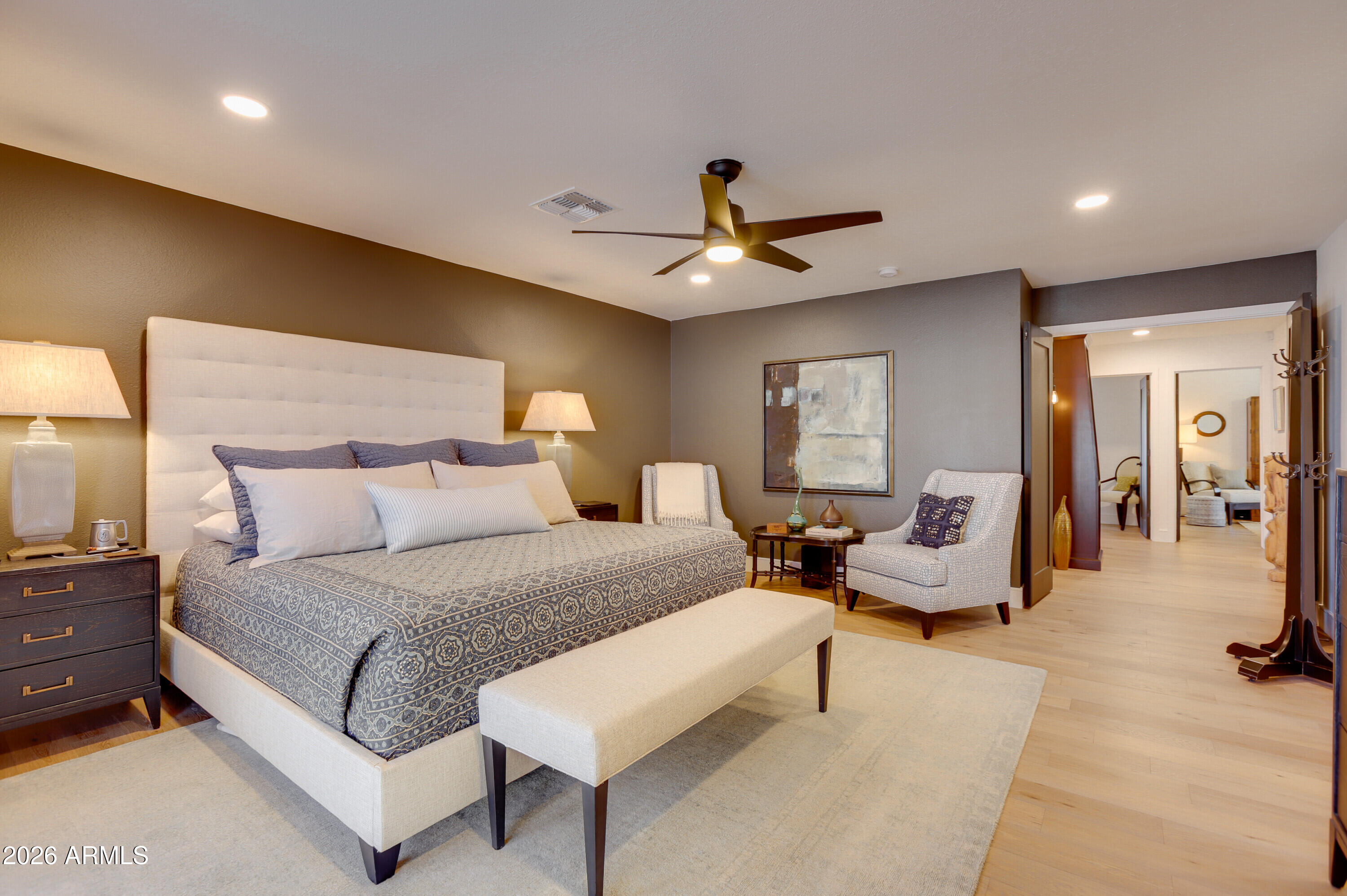 8220 North 1st Avenue Phoenix, AZ 85021 - Photo 33 of 53 a spacious bedroom with a bed a couch and a chandelier