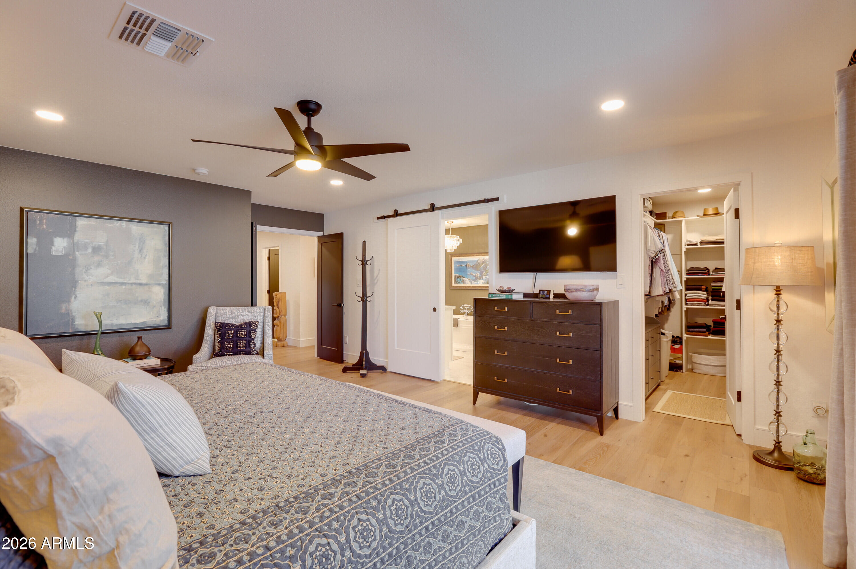 8220 North 1st Avenue Phoenix, AZ 85021 - Photo 34 of 53 a bedroom with a bed and a flat screen tv