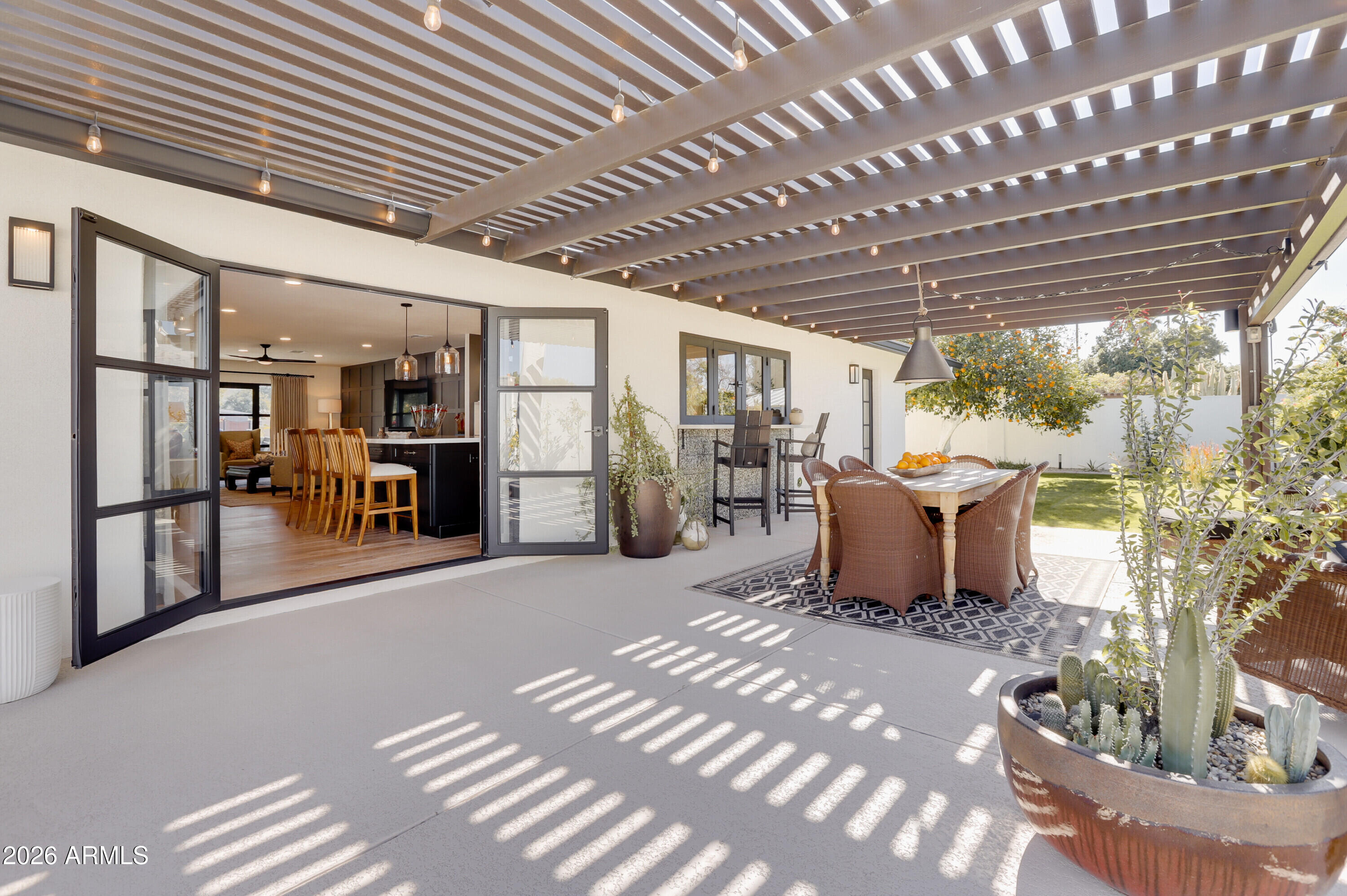 8220 North 1st Avenue Phoenix, AZ 85021 - Photo 41 of 53 a view of a patio with table and chairs and potted plants