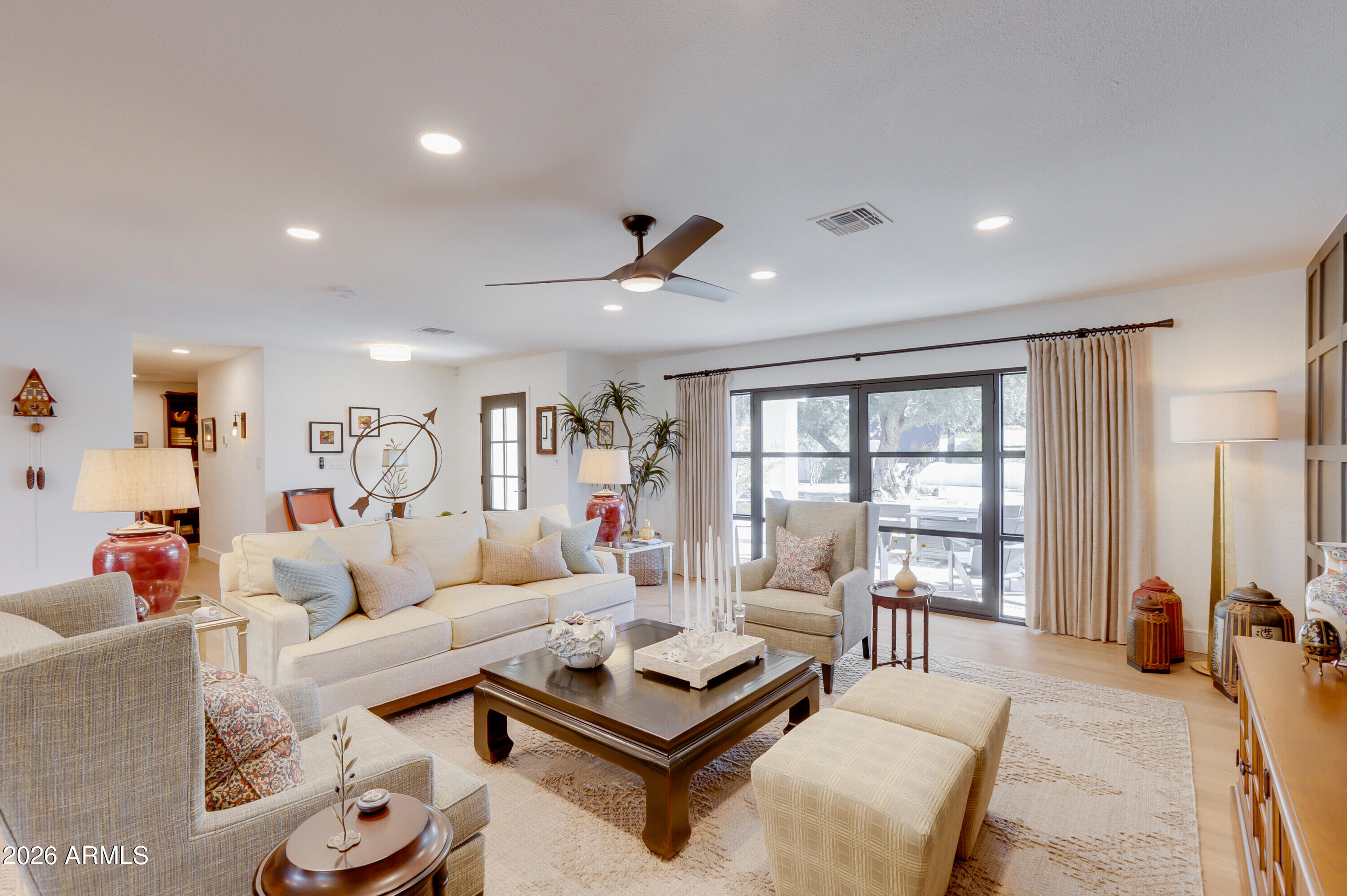 8220 North 1st Avenue Phoenix, AZ 85021 - Photo 9 of 53 a living room with furniture and a floor to ceiling window