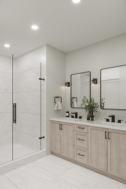 8 Rowell Road Danvers, MA 01923 - Photo 3 of 6 a bathroom with a double vanity sink and mirror