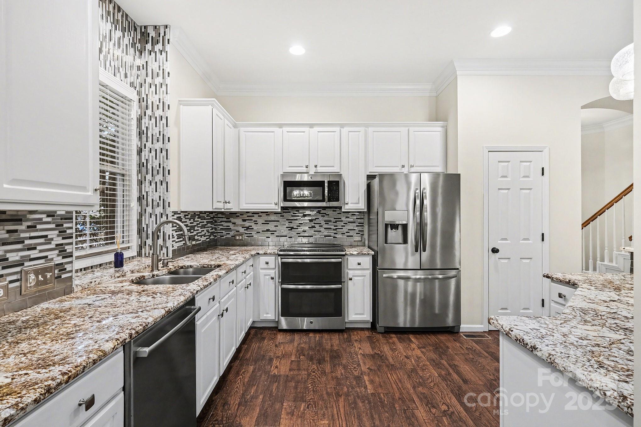 138 Blandina Court Fort Mill, SC 29708 - Photo 12 of 41 a kitchen with a sink stove and refrigerator