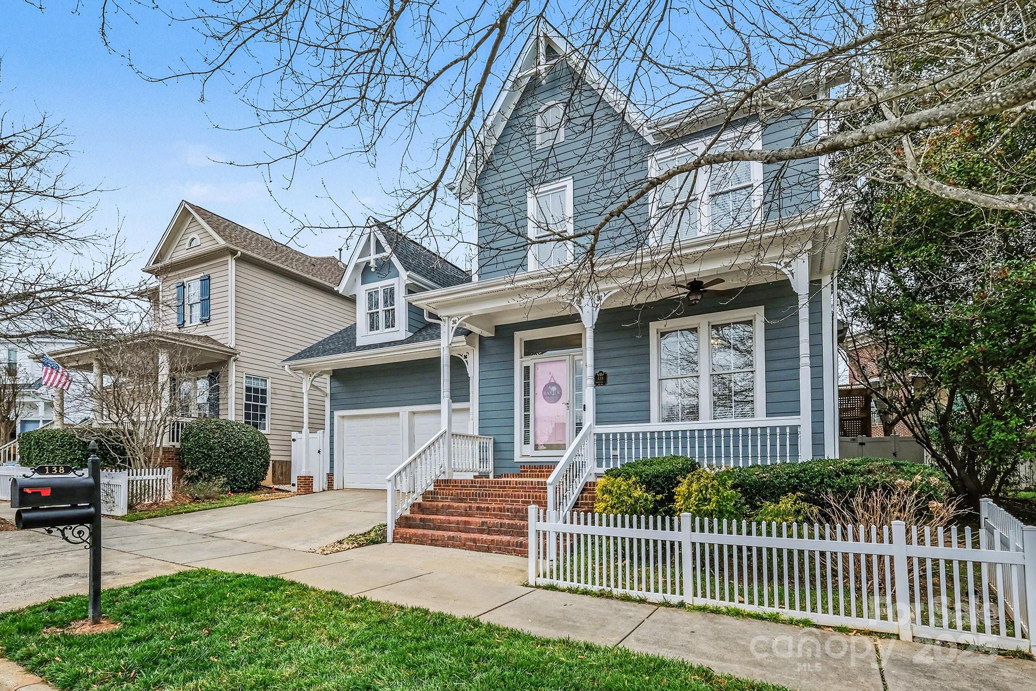 138 Blandina Court Fort Mill, SC 29708 - Photo 3 of 41 a front view of a house with a garden and plants