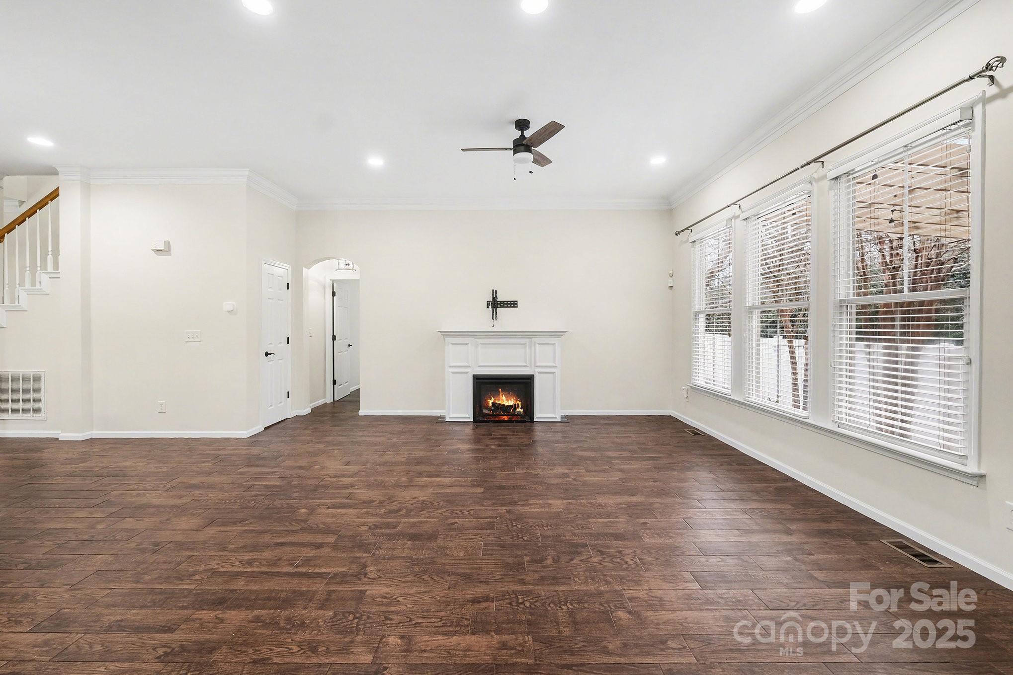 138 Blandina Court Fort Mill, SC 29708 - Photo 8 of 41 a view of an empty room with a fireplace and a window