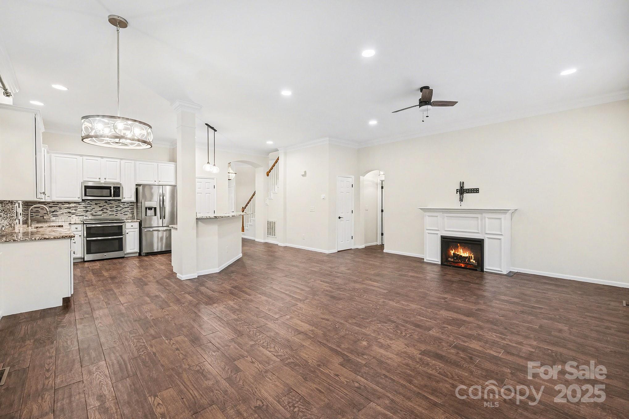 138 Blandina Court Fort Mill, SC 29708 - Photo 9 of 41 a view of a kitchen with a stove cabinets and wooden floor