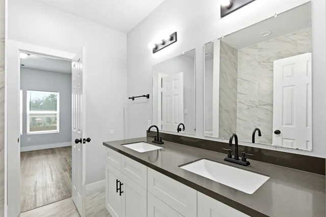 a bathroom with a sink and a mirror