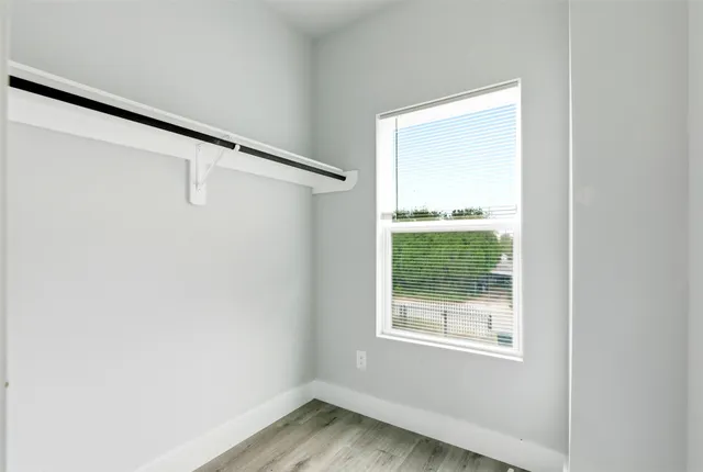 a view of an empty room with a window