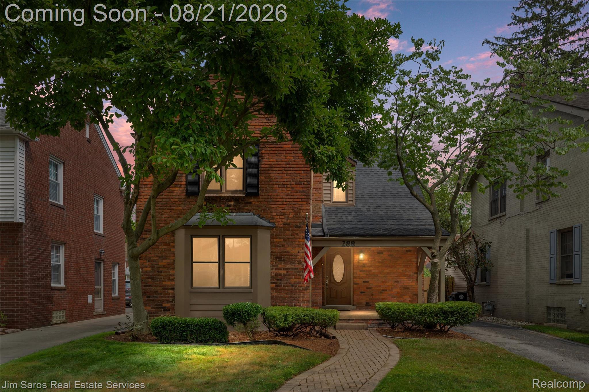 288 Moran Road Grosse Pointe, MI 48236 - Photo 24 of 24 Brick exterior with a covered entry, gabled roofline, and front landscaping