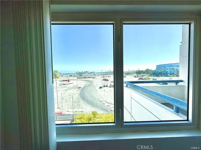 a view of a balcony next to a building