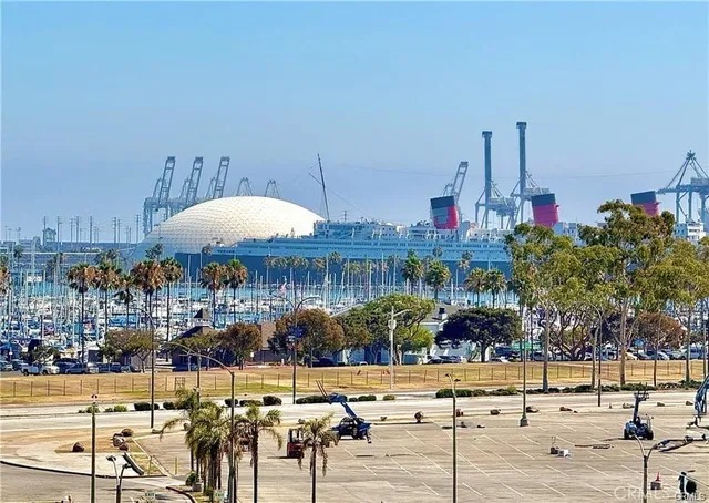 a view of a patio with couches table and chairs with wooden floor