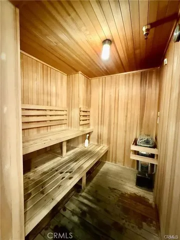 a view of a lake with boats next to a bridge