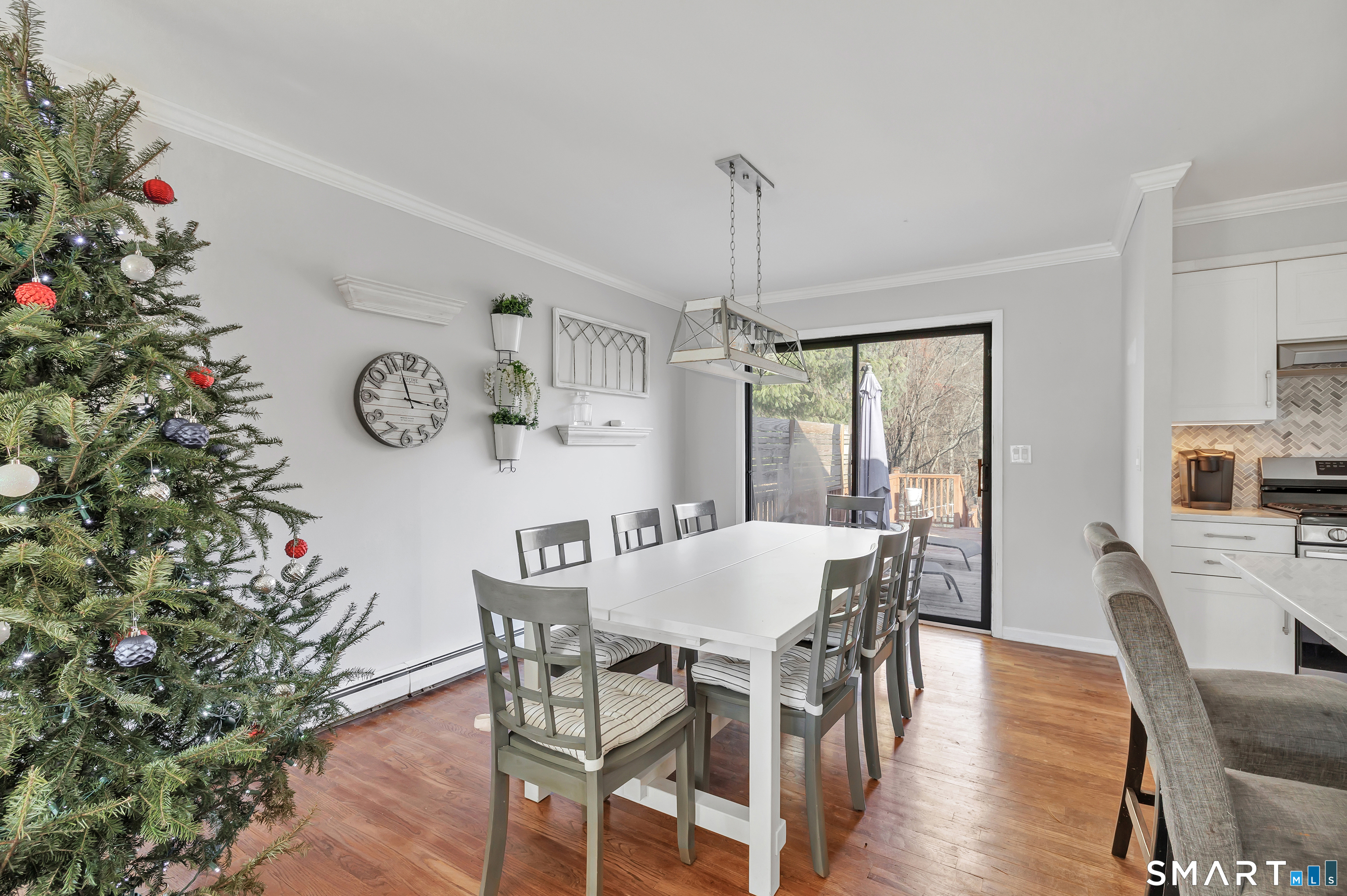 32 Autumn Ridge Road Milford, CT 06461 - Photo 12 of 40 a view of a dining room with furniture window and wooden floor