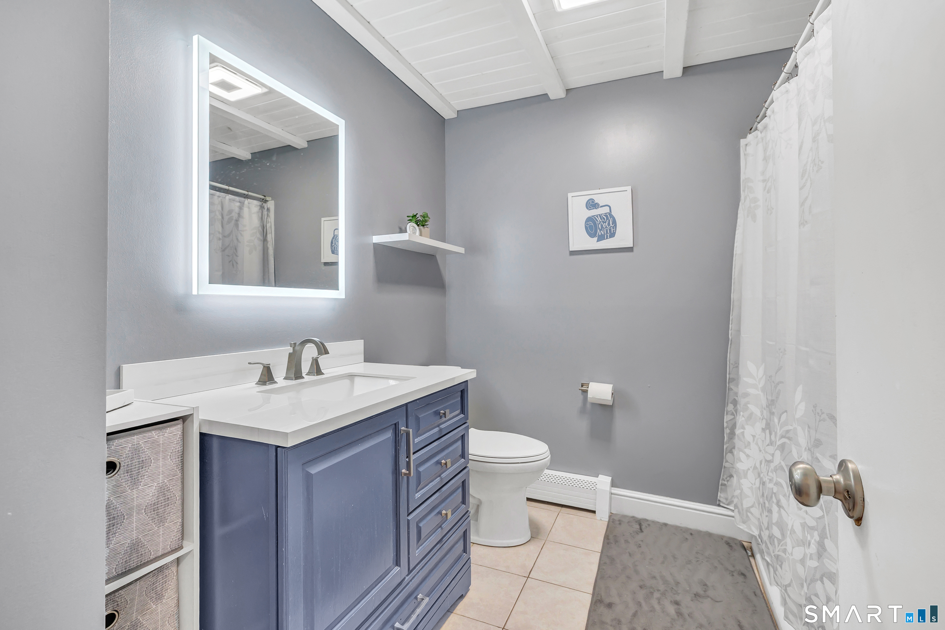 32 Autumn Ridge Road Milford, CT 06461 - Photo 17 of 40 a bathroom with a toilet a sink and mirror