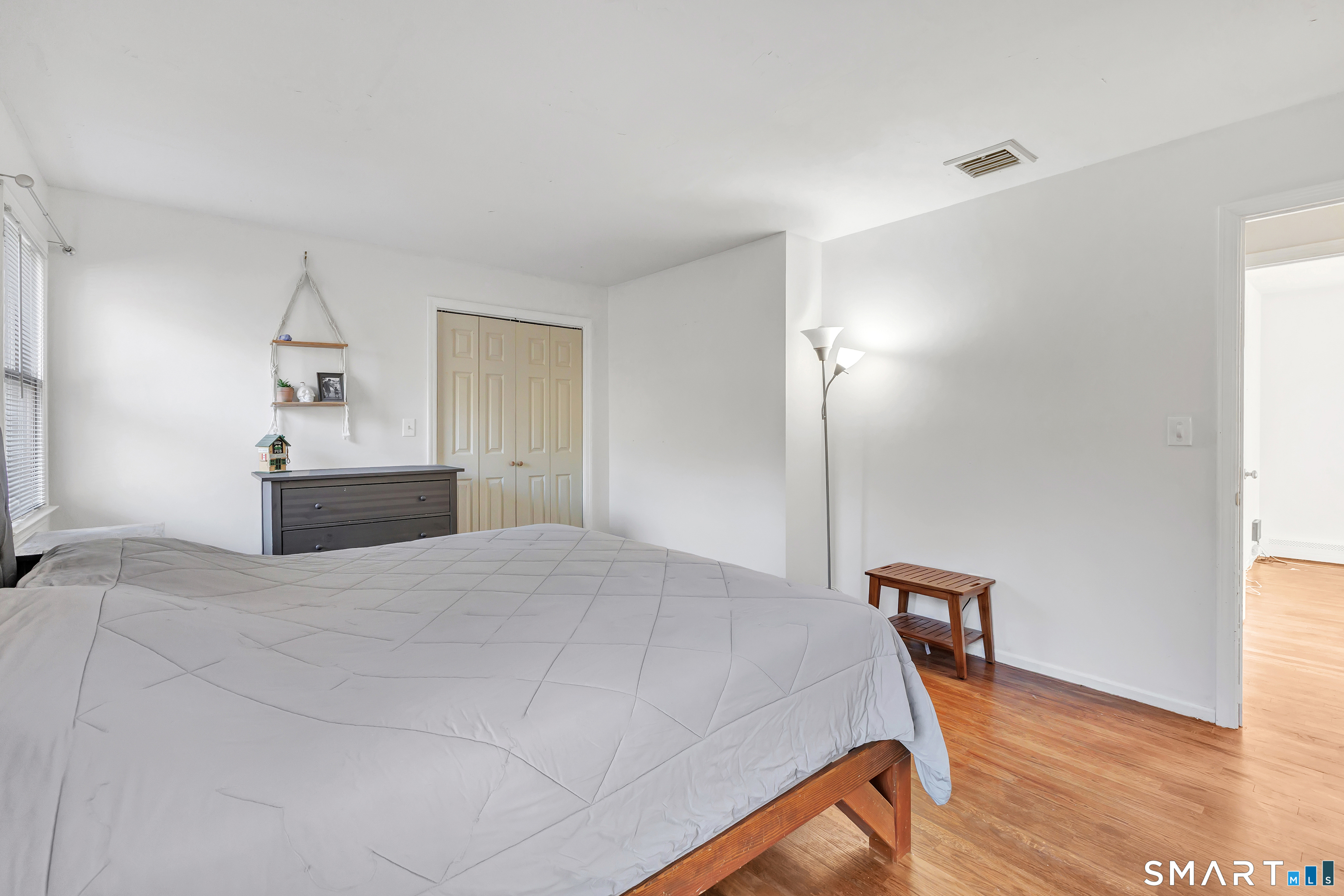 32 Autumn Ridge Road Milford, CT 06461 - Photo 19 of 40 a bedroom with a bed and a table in it