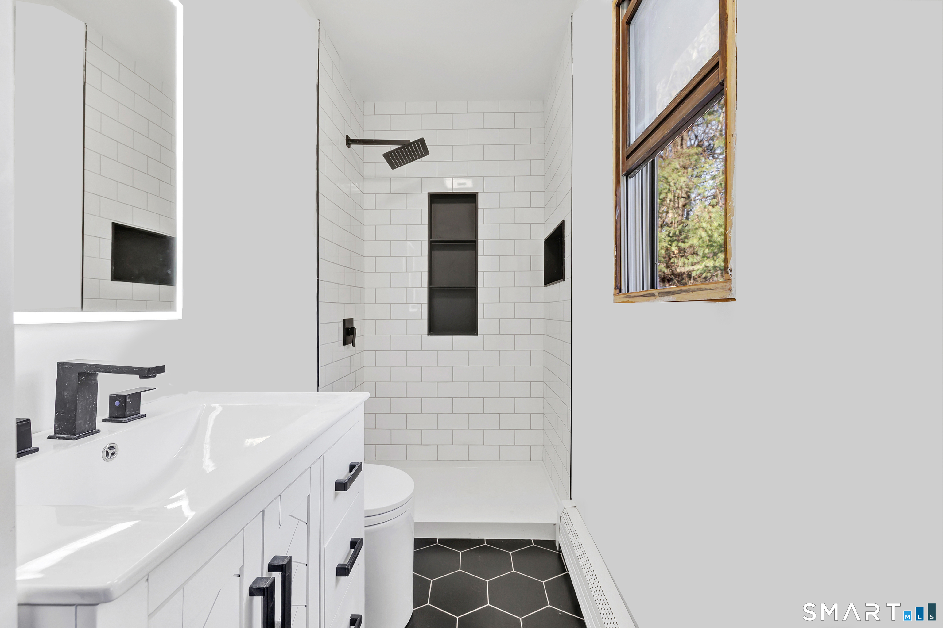 32 Autumn Ridge Road Milford, CT 06461 - Photo 21 of 40 a bathroom with a sink and a mirror