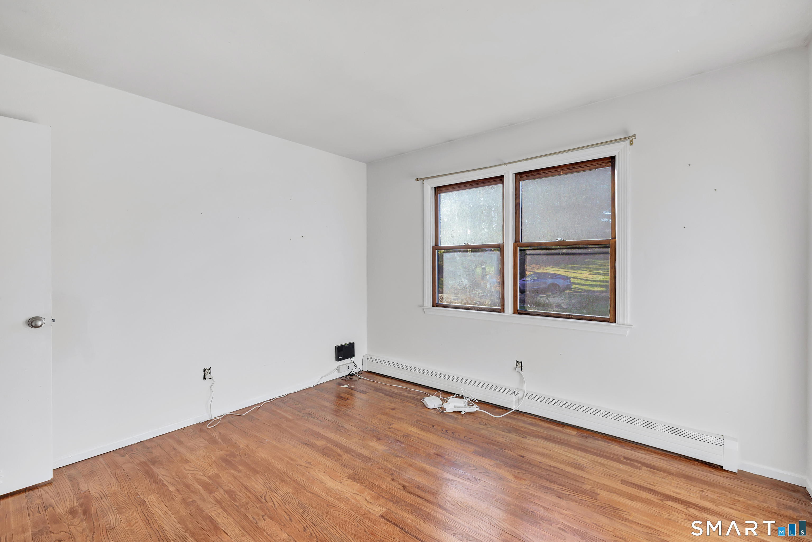32 Autumn Ridge Road Milford, CT 06461 - Photo 23 of 40 a view of empty room with wooden floor and fan