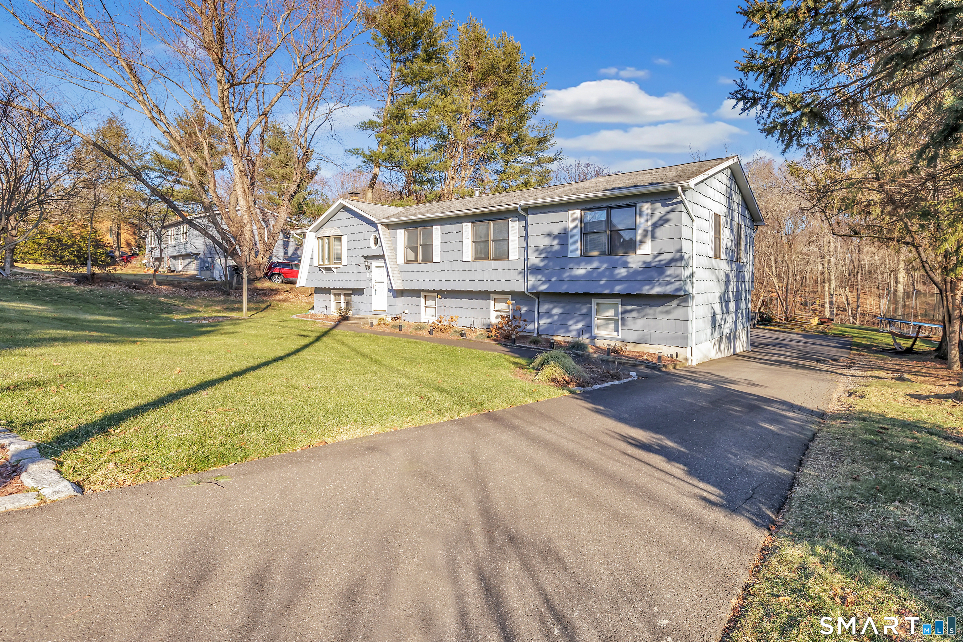 32 Autumn Ridge Road Milford, CT 06461 - Photo 3 of 40 a view of a house with a yard and large tree
