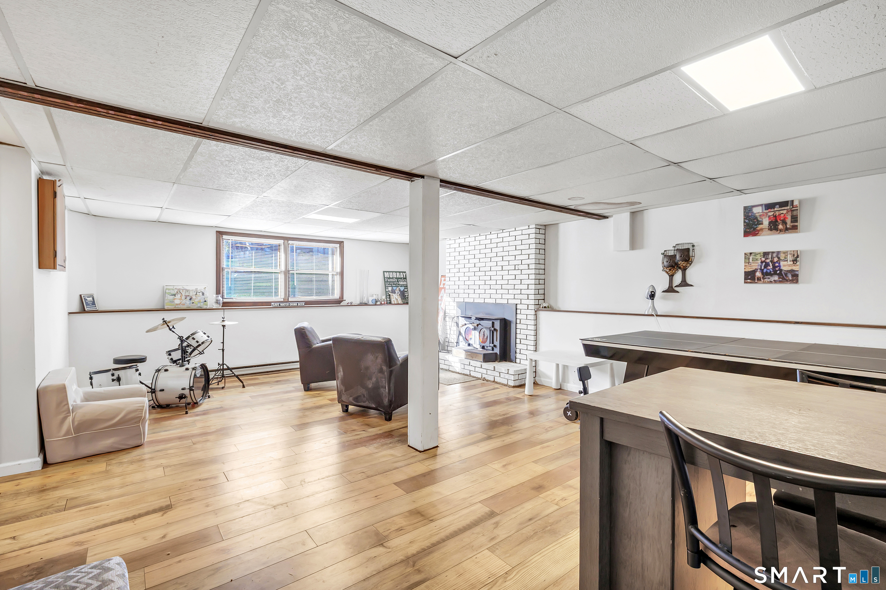 32 Autumn Ridge Road Milford, CT 06461 - Photo 33 of 40 a living room with furniture and a wooden floor