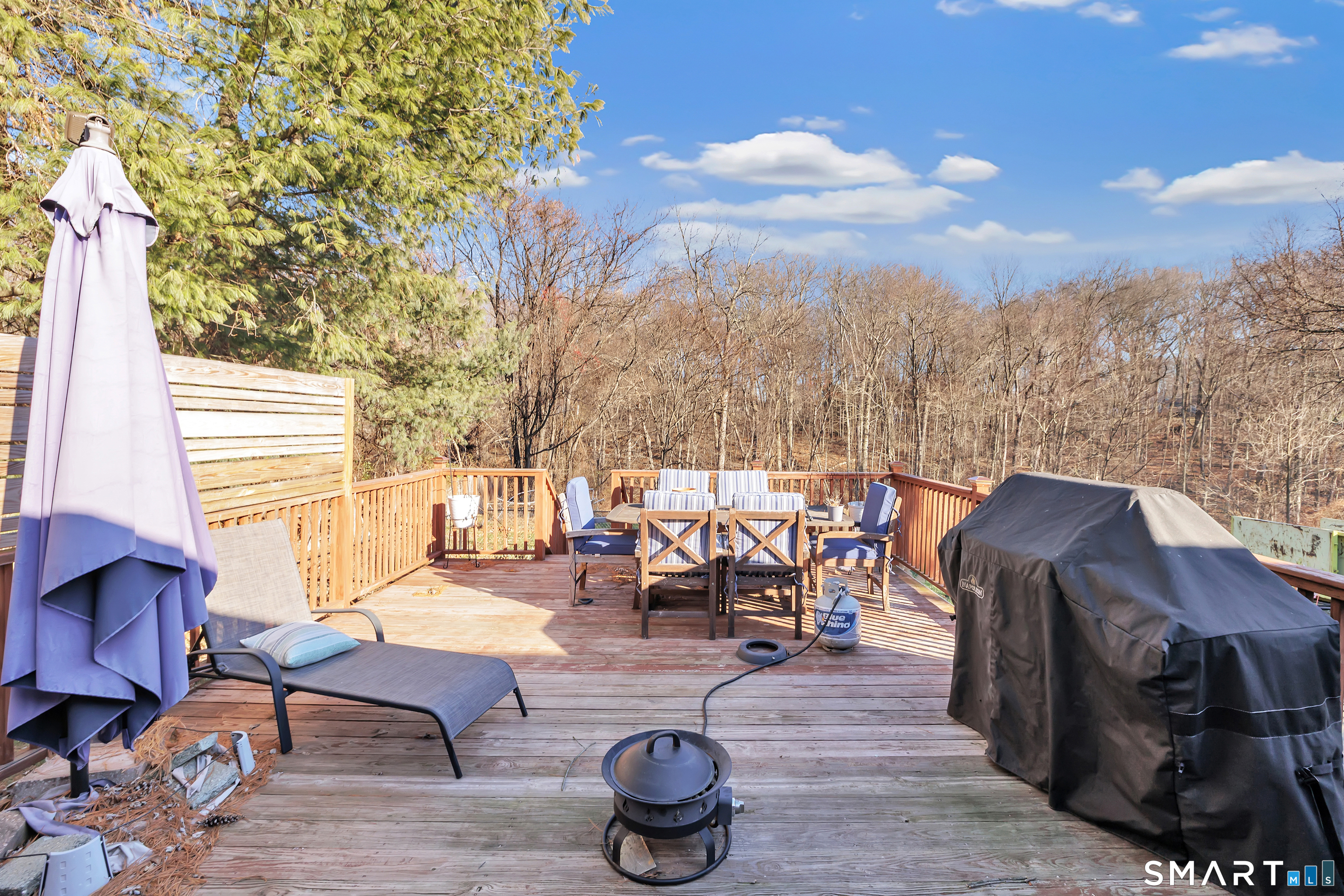 32 Autumn Ridge Road Milford, CT 06461 - Photo 35 of 40 a roof deck with table and chairs a barbeque with wooden floor and fence