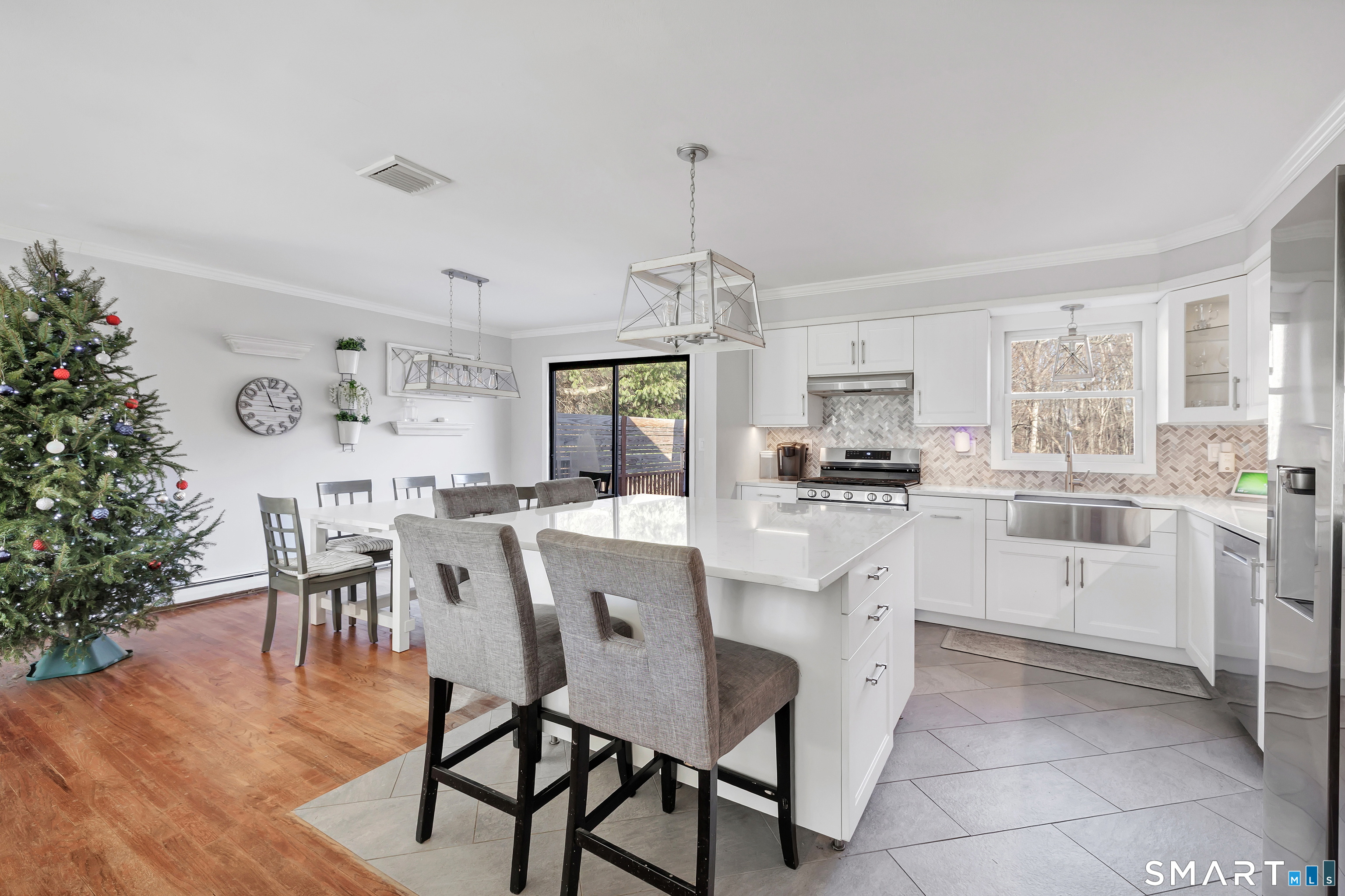 32 Autumn Ridge Road Milford, CT 06461 - Photo 5 of 40 a kitchen with a dining table chairs and cabinets