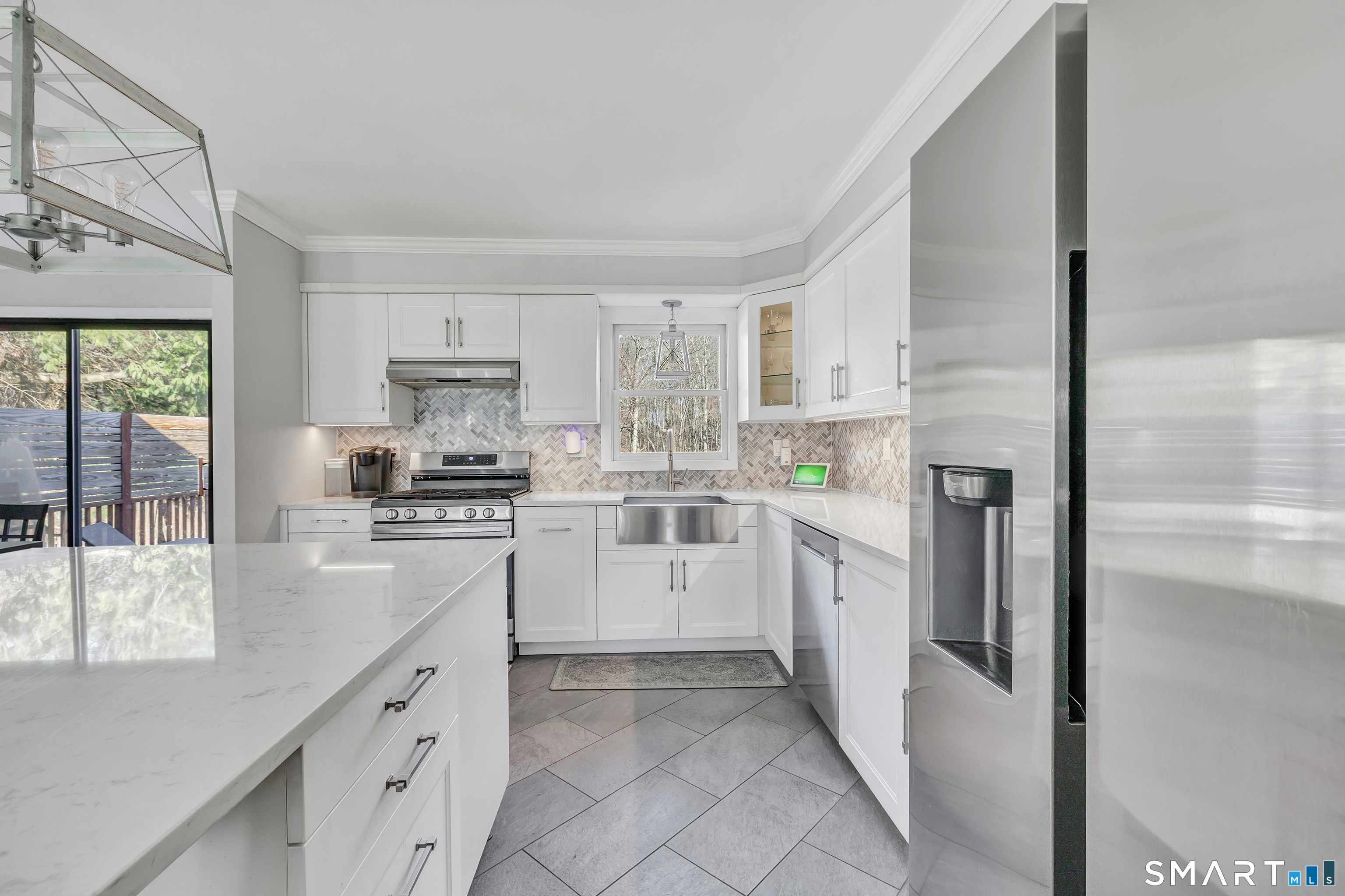 32 Autumn Ridge Road Milford, CT 06461 - Photo 8 of 40 a kitchen with white cabinets and white appliances