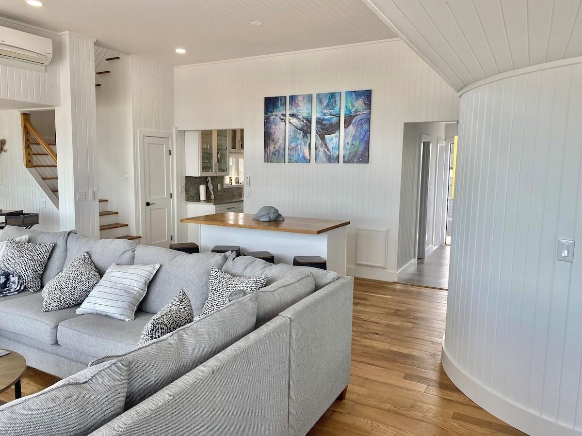 240 Wilmot Road Ocean Beach, NY 11770 - Photo 2 of 9 a living room with furniture and a wooden floor