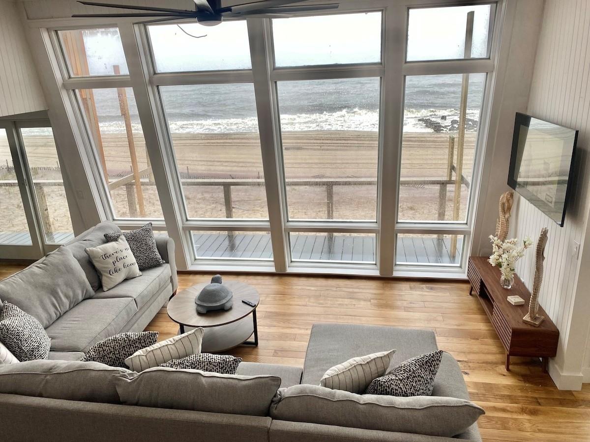 240 Wilmot Road Ocean Beach, NY 11770 - Photo 3 of 9 a living room with furniture and a flat screen tv