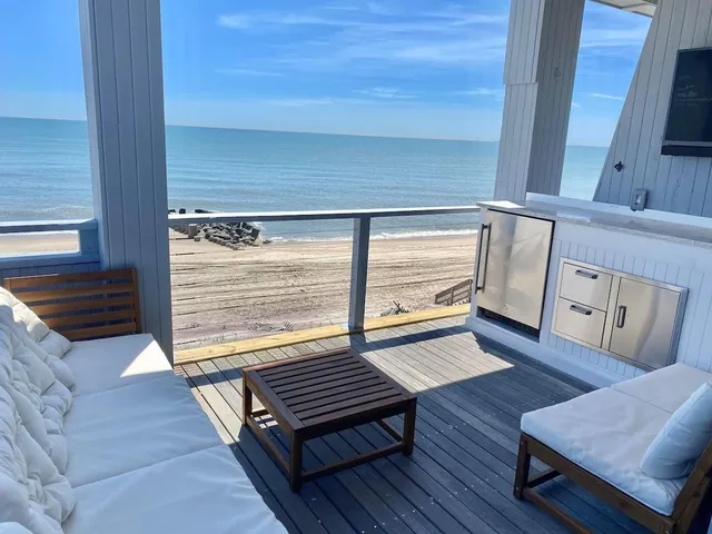 a living room with wooden floors and a couch