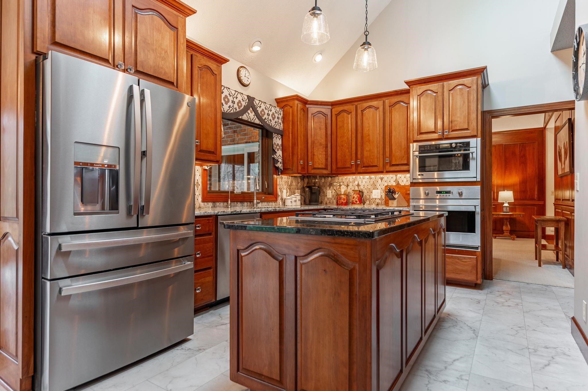 8161 Killarney Aire Road Roscoe, IL 61073 - Photo 13 of 53 a kitchen with stainless steel appliances granite countertop a refrigerator stove and sink