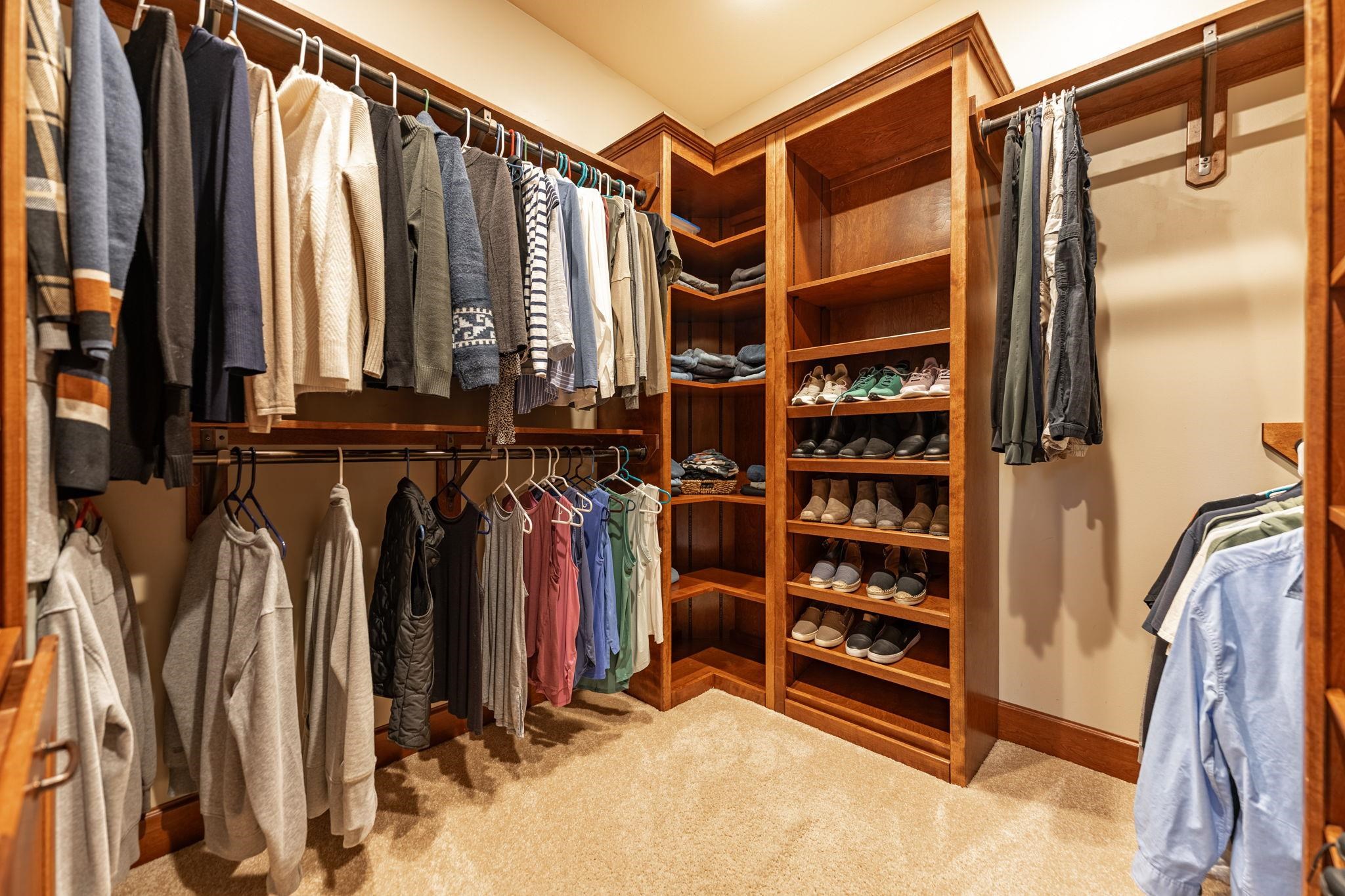 8161 Killarney Aire Road Roscoe, IL 61073 - Photo 25 of 53 a view of walk in closet with clothes and shoes