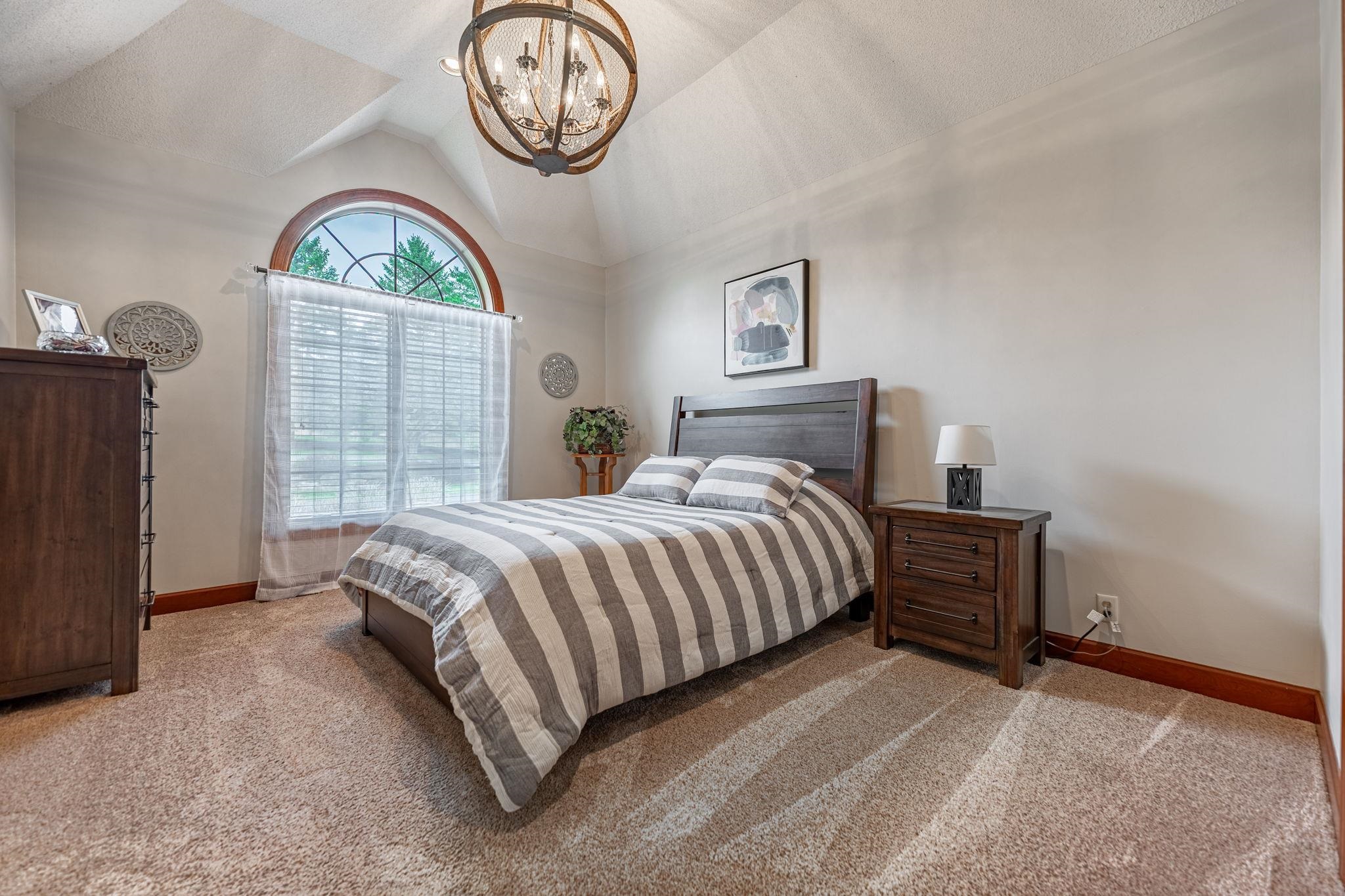 8161 Killarney Aire Road Roscoe, IL 61073 - Photo 26 of 53 a spacious bedroom with a bed and a closet in it