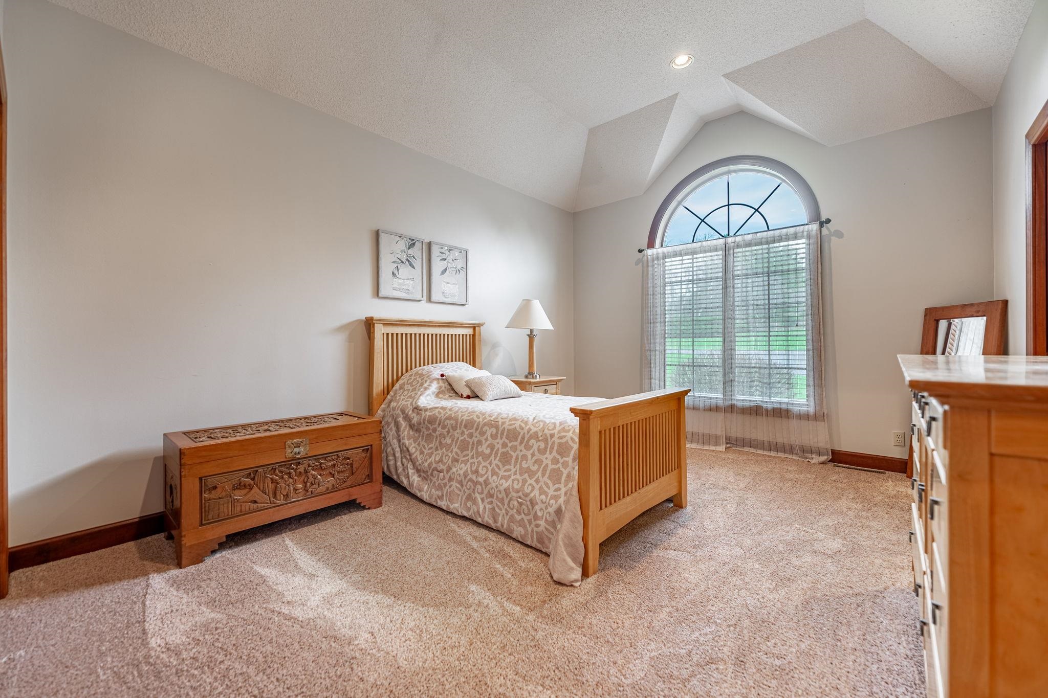 8161 Killarney Aire Road Roscoe, IL 61073 - Photo 31 of 53 a room with a bed and a view of mirror
